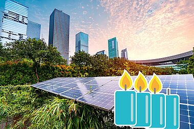 Ein Photovoltaik-Modul liegt auf einer Wiese. Im Hintergrund stehen Hochhäuser.